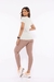 Camiseta Rebeca Dipaula Dry Fit Branca vista traseira, com detalhes em recortes e modelo ajustado.