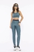 Legging academia Di Paula Rejane na cor verde azulado, combinada com top destacando seu design moderno e funcional para atividades físicas.