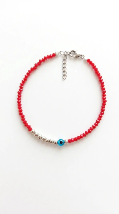 Pulsera de 9 Bolitas de Plata y Dije Ojo Turco en el Centro con Cristales Rojos a Ambos Lados