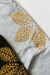 5/2 REMERA OJAS DORADAS - Avellaneda Moda