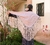 Small shawl made of beige Spanish fabric with white polka dots