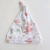 GORRO CON NUDO MANCHAS ROSAS - comprar online