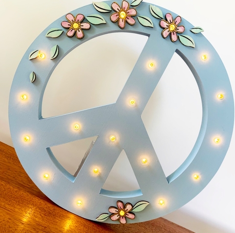 Cartel luminoso “Símbolo Paz” con flores