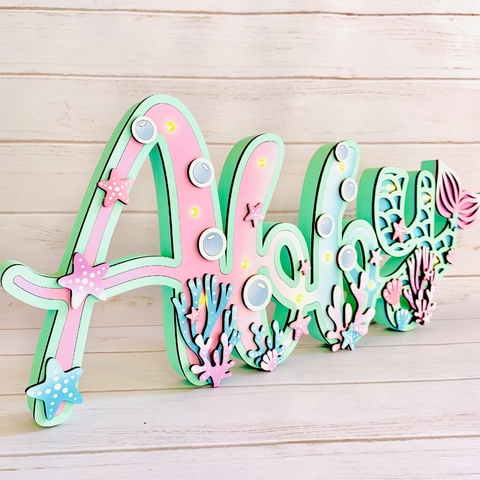 Cartel luminoso Nombre “Bajo el mar”