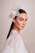 Made by Graciella Starling, the Haute Chapelry. Off-white fascinator with a side, perfect for weddings. It can be called a cap. Inspired by Princess Kate Mildleton. It can be worn for day or night events.