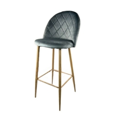 Banqueta Sybil tapizada en pana con base de madera, diseño moderno y elegante.
