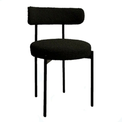 Silla tapizada Origin Boucle en color negro con estructura metálica.