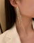 Par de brincos pendentes de strass