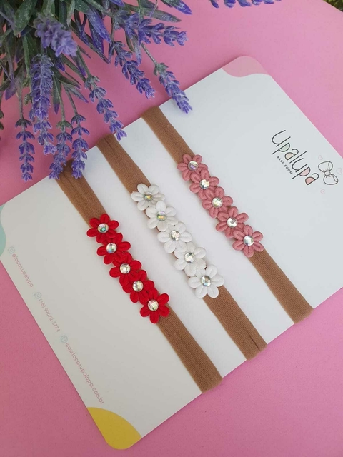 Faixa de florzinha com stras - und