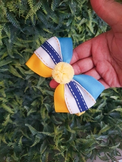 Tiara escolar amarela com azul na internet