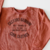 Buzo cuello redondo estampa con relieve en internet