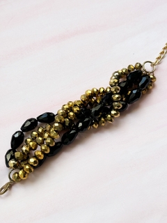 Pulsera negra y dorada SADIE en internet