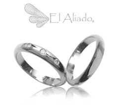 1023. Argollas en Oro Blanco 18K media caña.