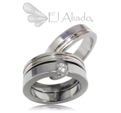 1147. Argollas y pisa argolla en Titanio con oro rosado 18k.