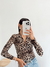 camiseta chomba morley de manga larga con estampado animal print en tonos beige y negro