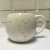 Taza Burbuja Blanco Signos con Dorado en internet