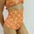 Culotte Tiro Alto Colaless Alice - Naranja Flores Blancas (SBIK49AD) - Santos & Santas