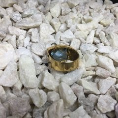 Imagen de Anillo con cubic y agua marina central de oro 18K