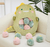 PELUCHE CON MINI PELUCHES BEBÉ DINOSAURIO
