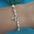 Pulseira pérolas cruz coração - comprar online