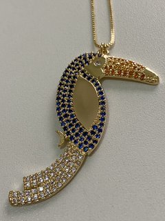 Tucano cravejado banhado a ouro 18k na internet