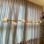 Lustre Pendente Moderno Dourado 7 bolas branca - comprar online