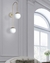 Arandela Jabuticaba UP Dourado 2 Globos Branco - loja online