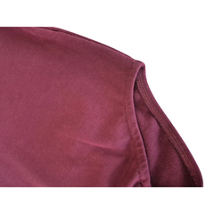 Body bebê de manga longa na cor magenta, com botões de pressão no ombro e na parte inferior