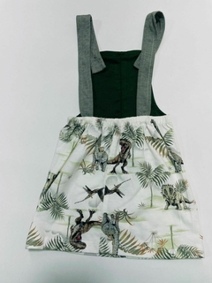 ardineira infantil com estampa de dinossauros e folhas verdes.