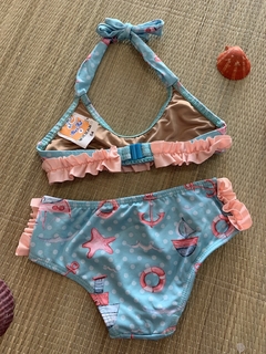 CONJUNTO TOP C/ BABADO E CALCINHA MÉDIA AZUL COM DESENHOS na internet