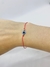 Pulsera hilo protector rojo con ojito regulable