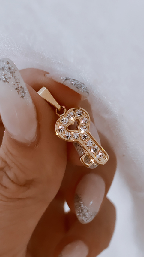 DIJE KEY ORO 18 K BP