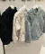 15714-CAMPERA PELUCHE CON NENA en internet